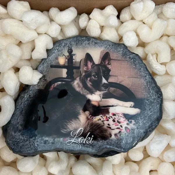 Finished memorial stone of Loki, packed in foam peanuts and ready to ship